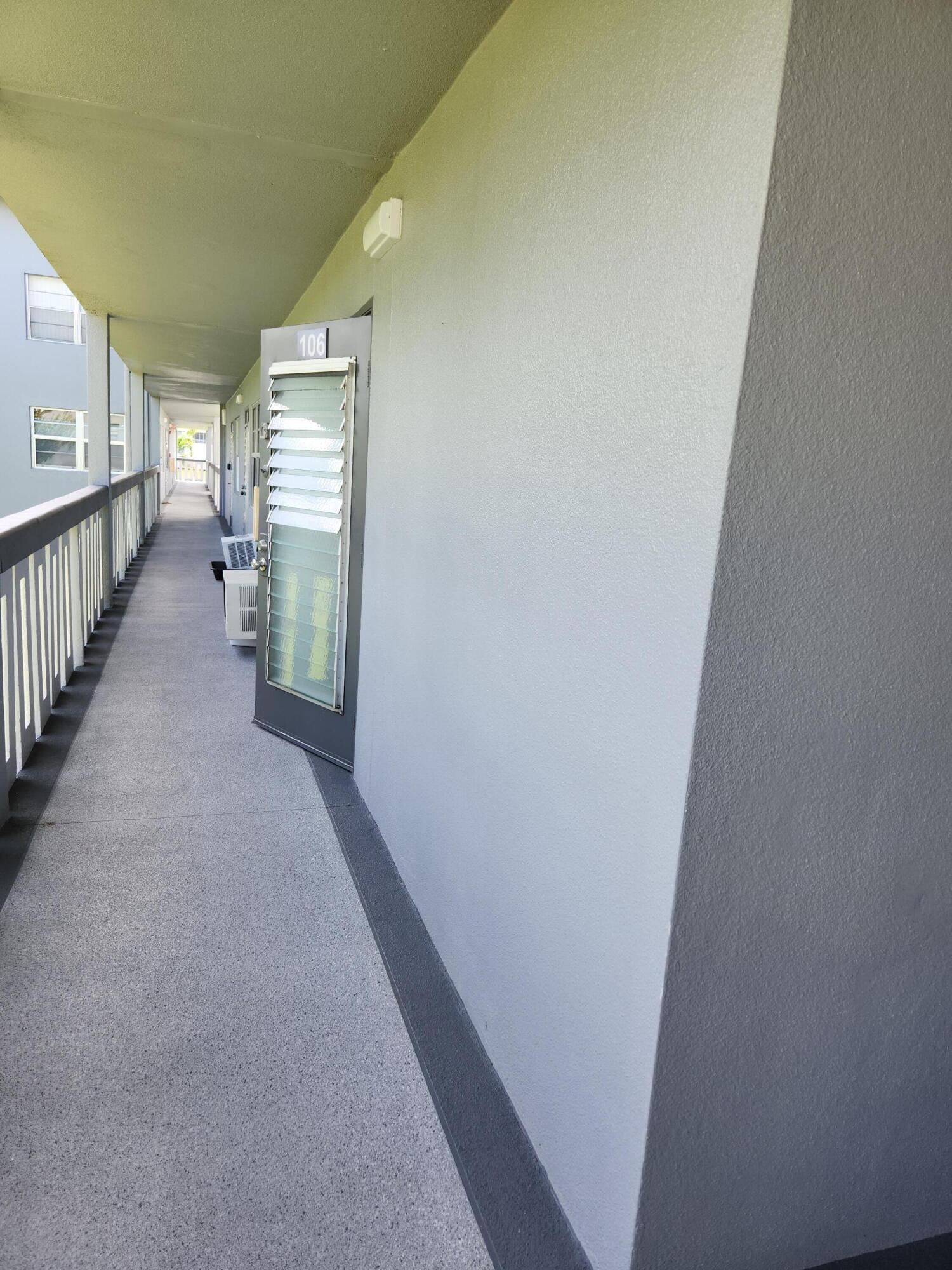 a view of a hallway with windows