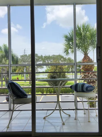 a bathroom with a granite countertop toilet and a sink