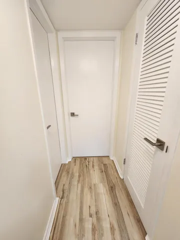 a view of an empty room with a fireplace