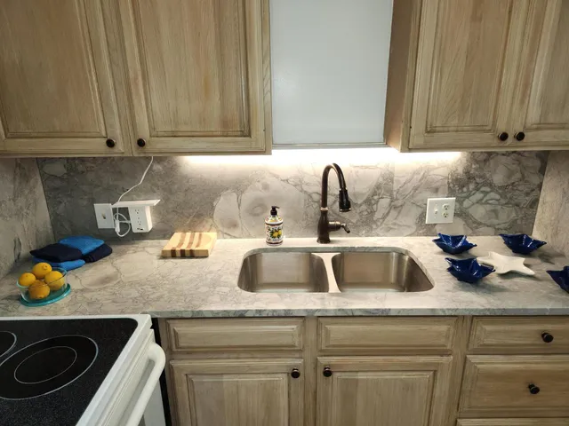 a kitchen with a stove cabinets and refrigerator