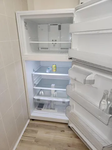 a stove top oven sitting inside of a kitchen