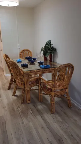 a view of a room with wooden floor and a window