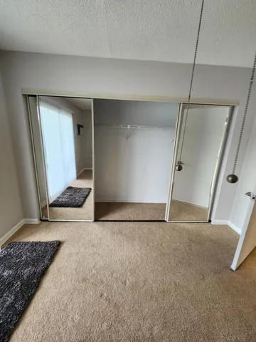 a view of two chairs and a table in a window