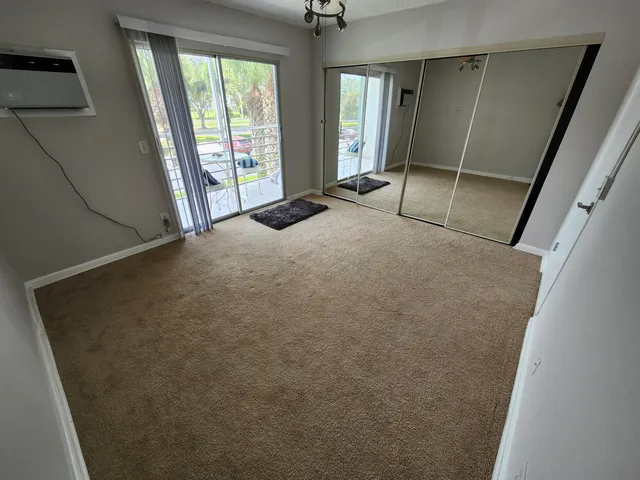 a view of an empty room with a fireplace