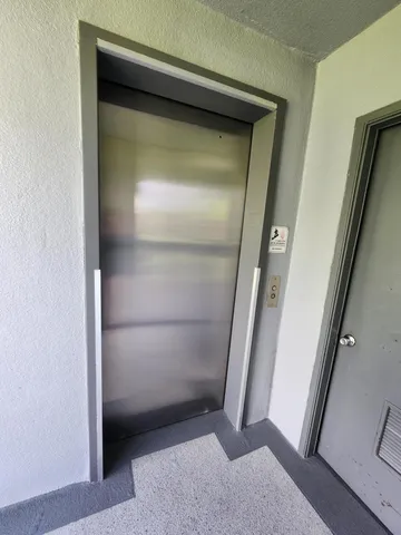 a view of a workspace with furniture