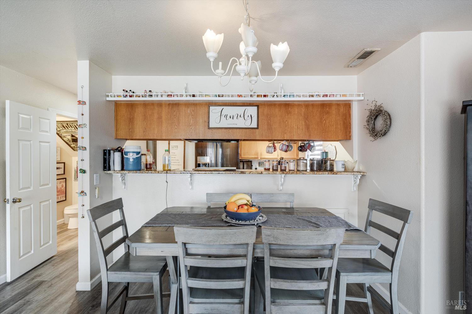 590 Laurel Grove Circle Santa Rosa, CA 95407 - Photo 32 of 44 a view of a dining room with furniture and wooden floor
