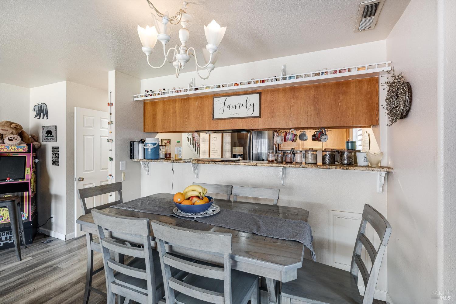 590 Laurel Grove Circle Santa Rosa, CA 95407 - Photo 33 of 44 a view of a dining room with furniture and wooden floor