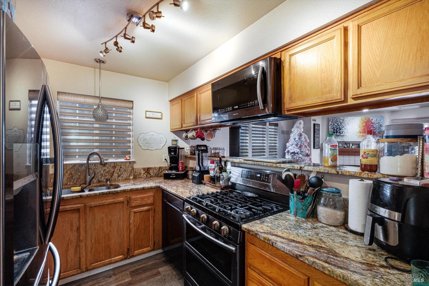 590 Laurel Grove Circle Santa Rosa, CA 95407 - Photo 35 of 44 a kitchen with a stove and a microwave