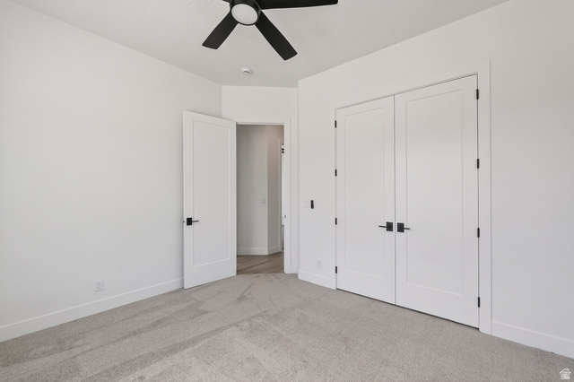 2862 South Mountain Rnch Road Cedar City, UT 84720 - Photo 35 of 64 Room featuring light-toned carpeting, white walls, and a modern ceiling fan