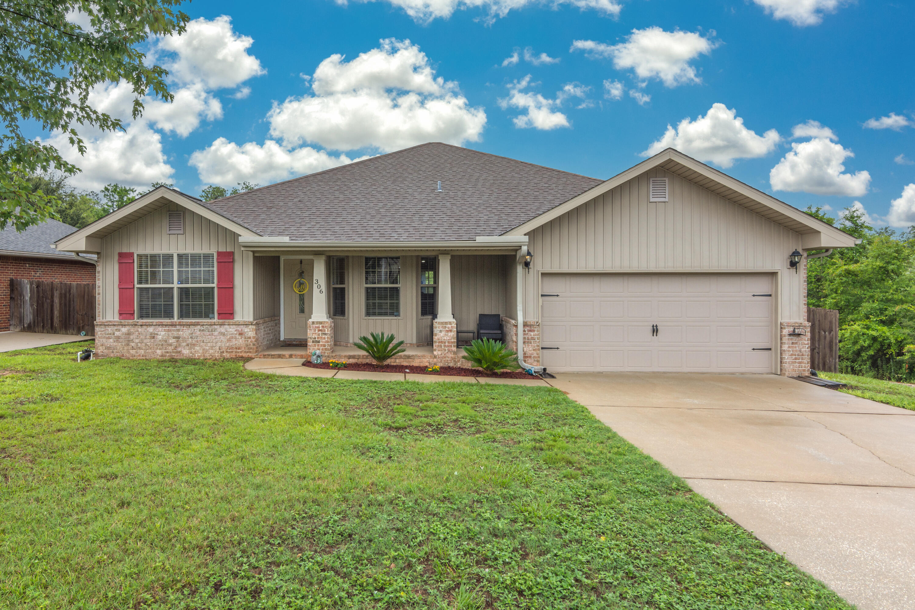 306 Gauntlet Drive Crestview, FL 32539 - Photo 1 of 32 a view of a house with a yard and sitting area