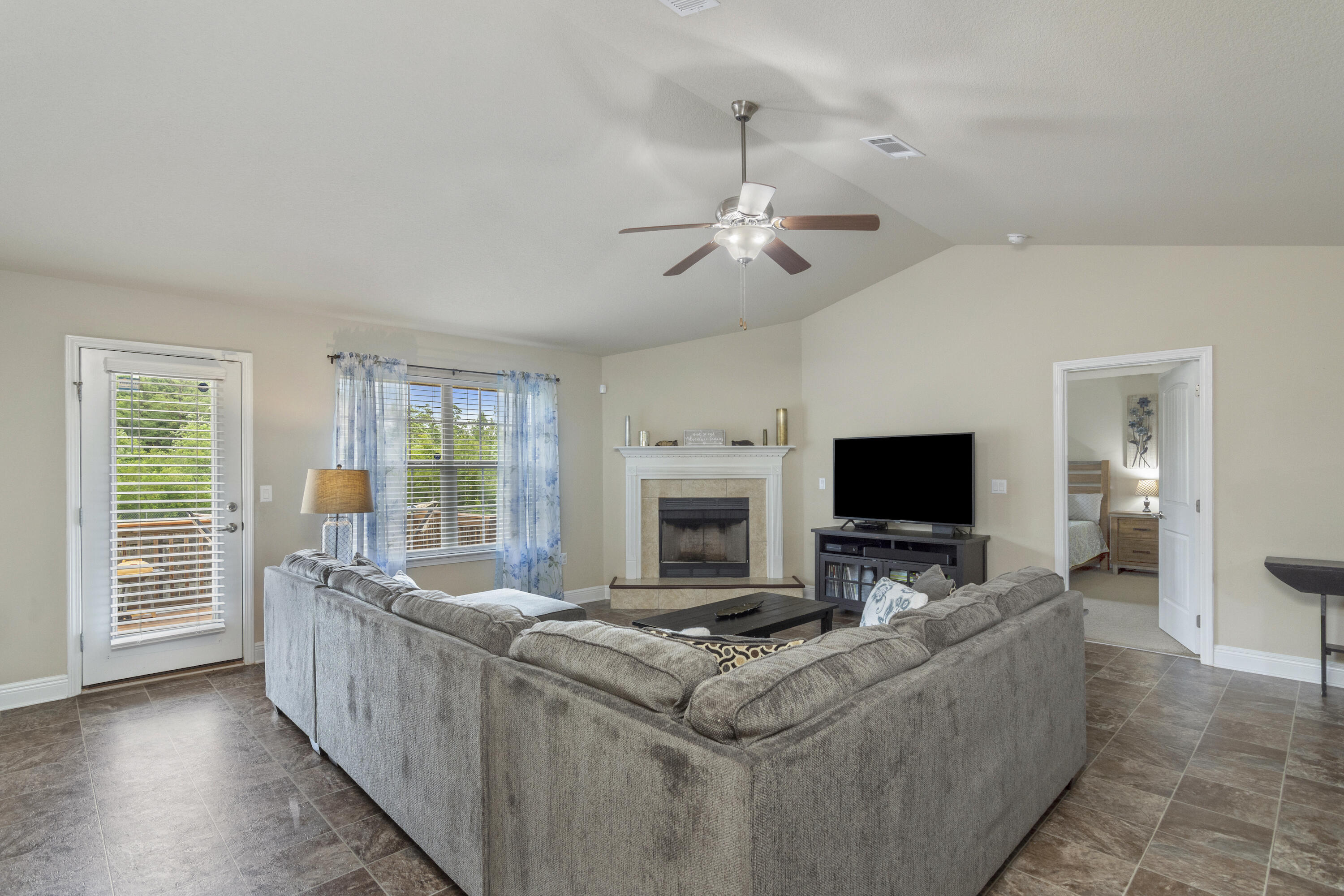 306 Gauntlet Drive Crestview, FL 32539 - Photo 12 of 32 a living room with furniture and a flat screen tv