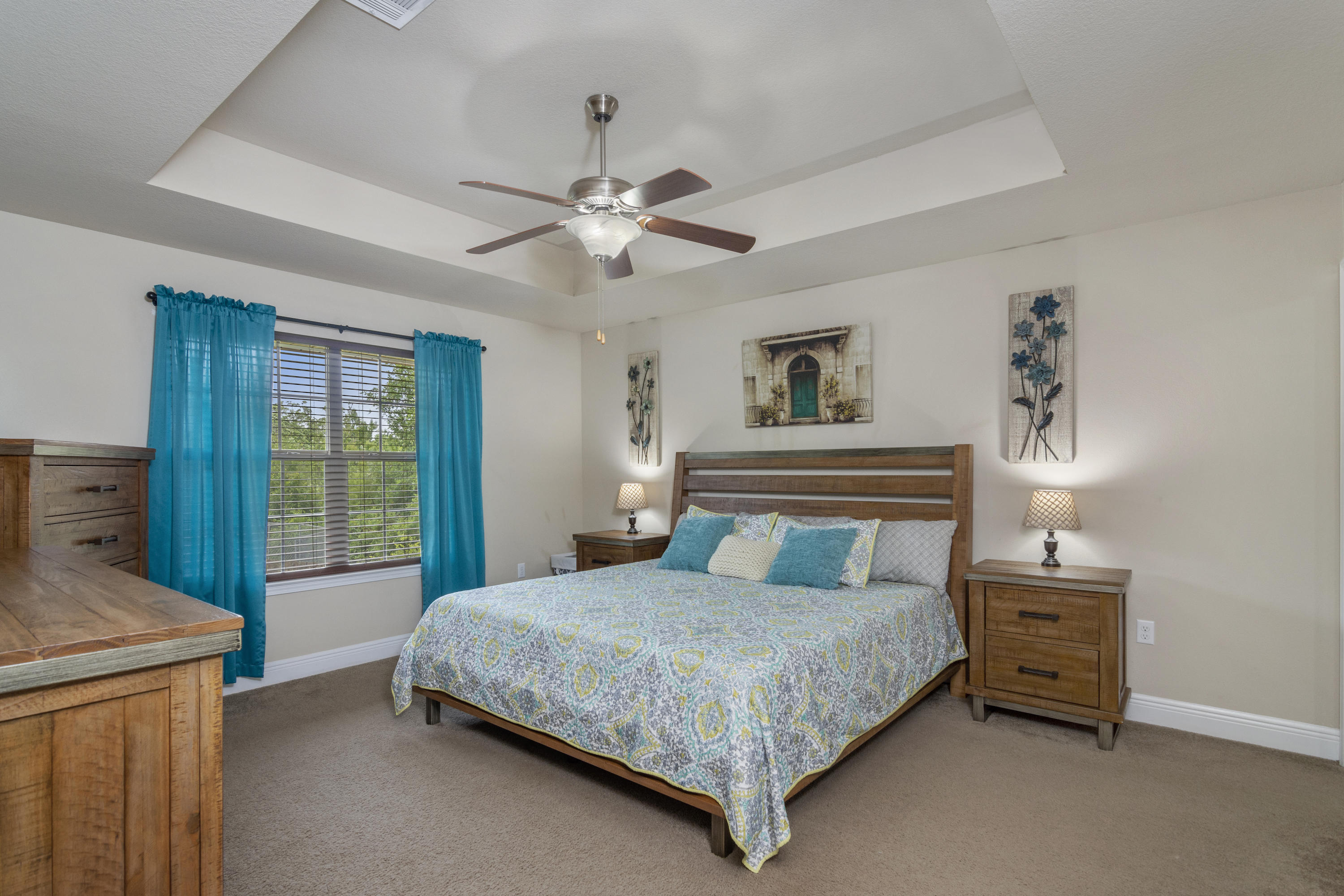 306 Gauntlet Drive Crestview, FL 32539 - Photo 14 of 32 a bedroom with a bed and a chandelier