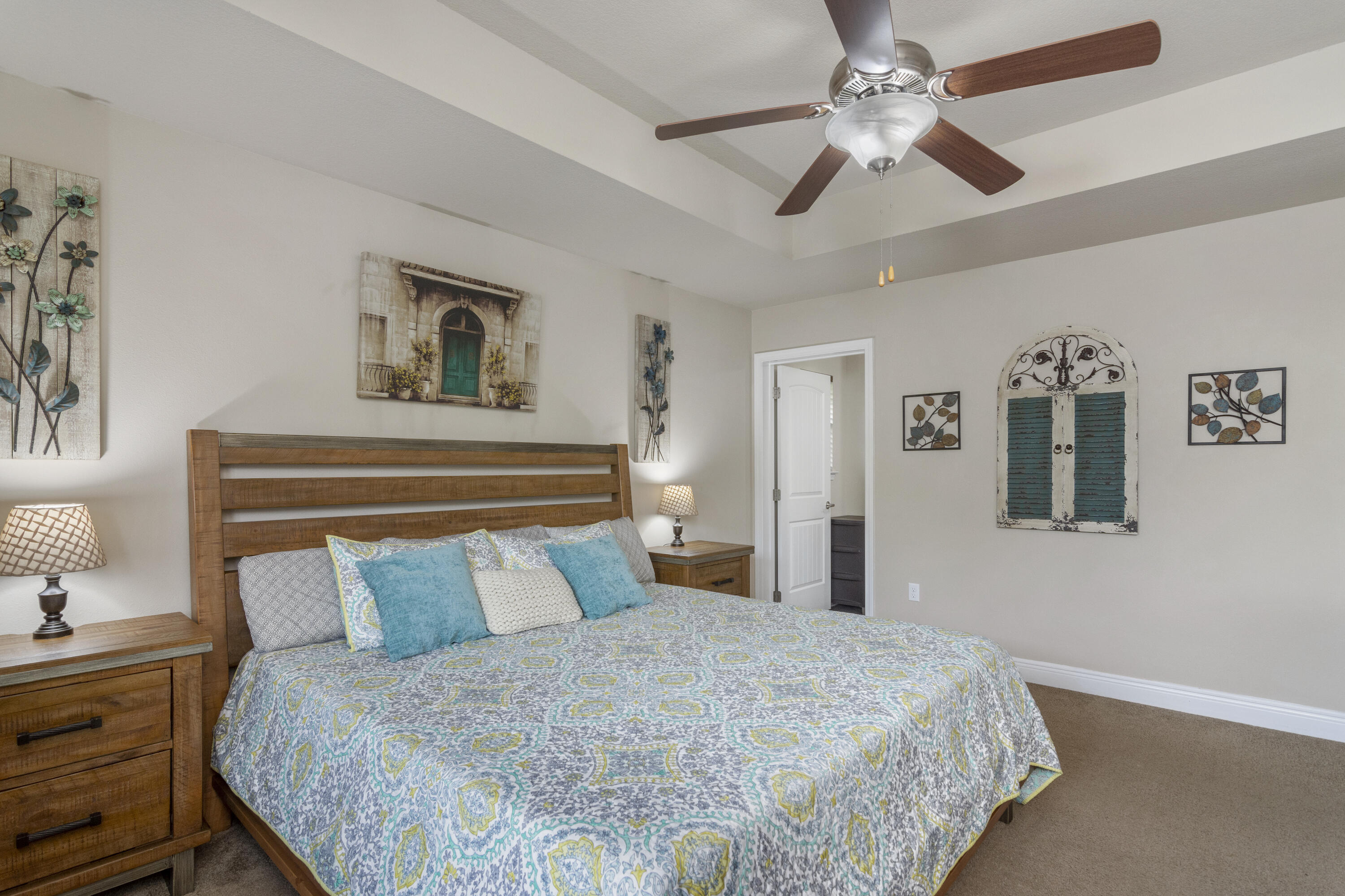 306 Gauntlet Drive Crestview, FL 32539 - Photo 15 of 32 a bedroom with a bed and a chandelier