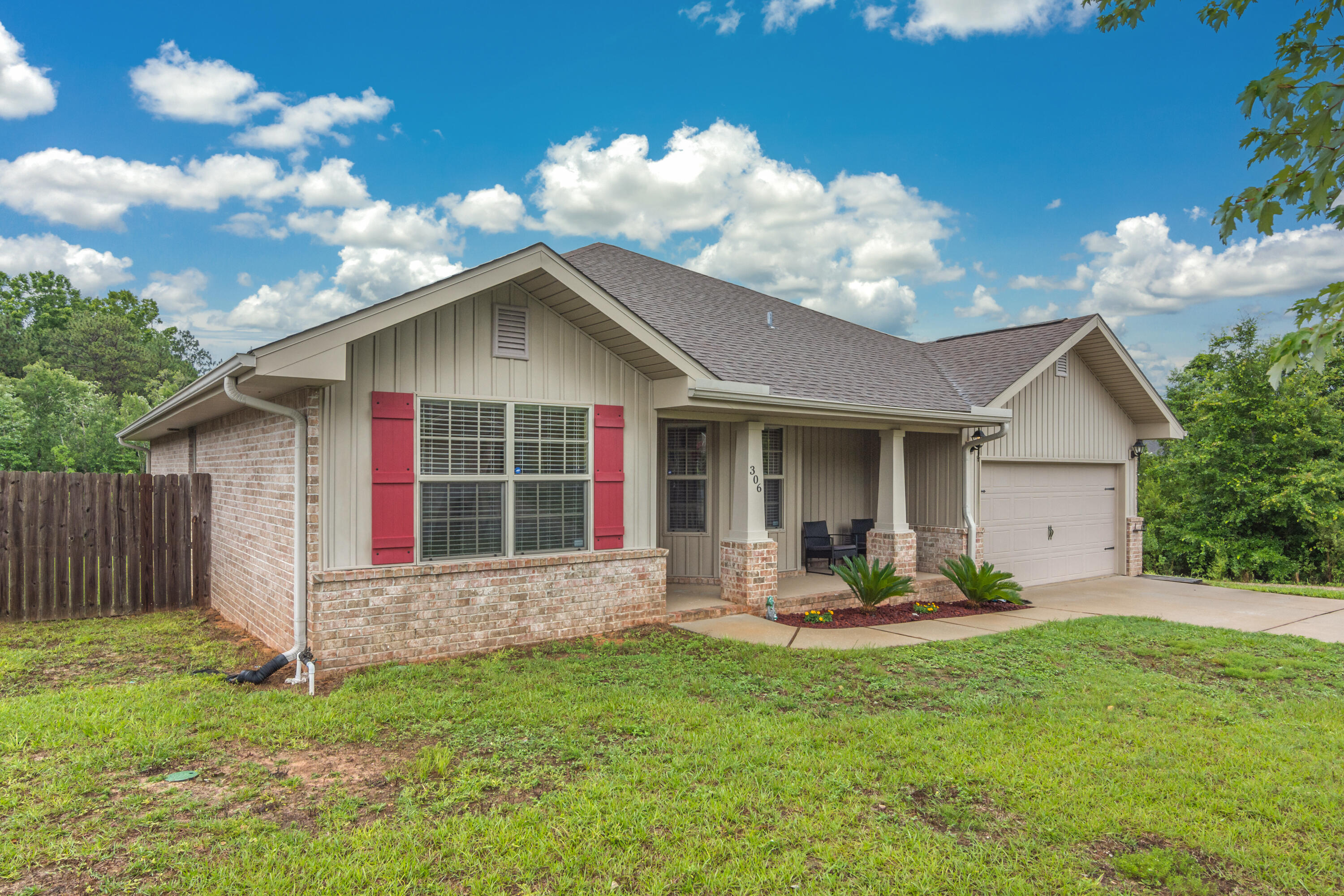 306 Gauntlet Drive Crestview, FL 32539 - Photo 2 of 32 a front view of a house with a yard and porch