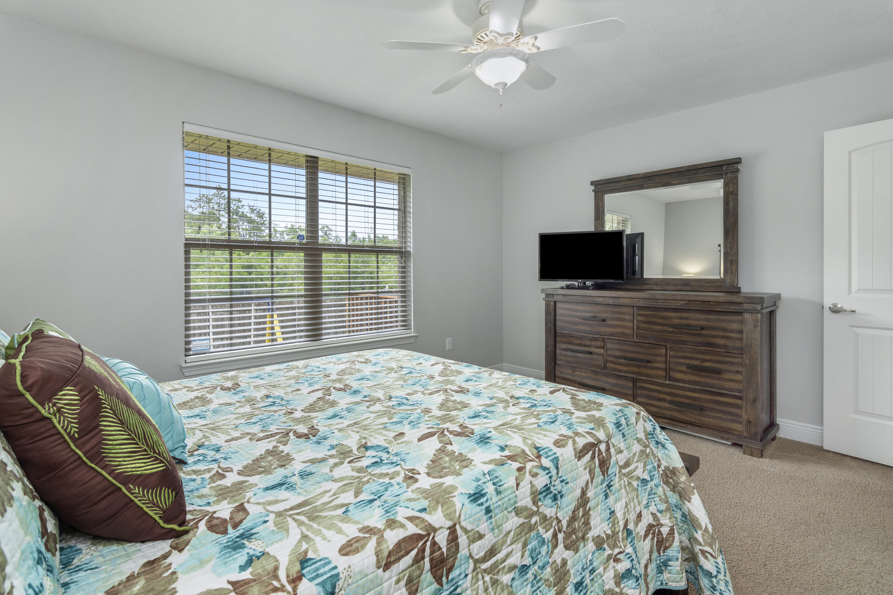 306 Gauntlet Drive Crestview, FL 32539 - Photo 27 of 32 a bedroom with a bed and a television