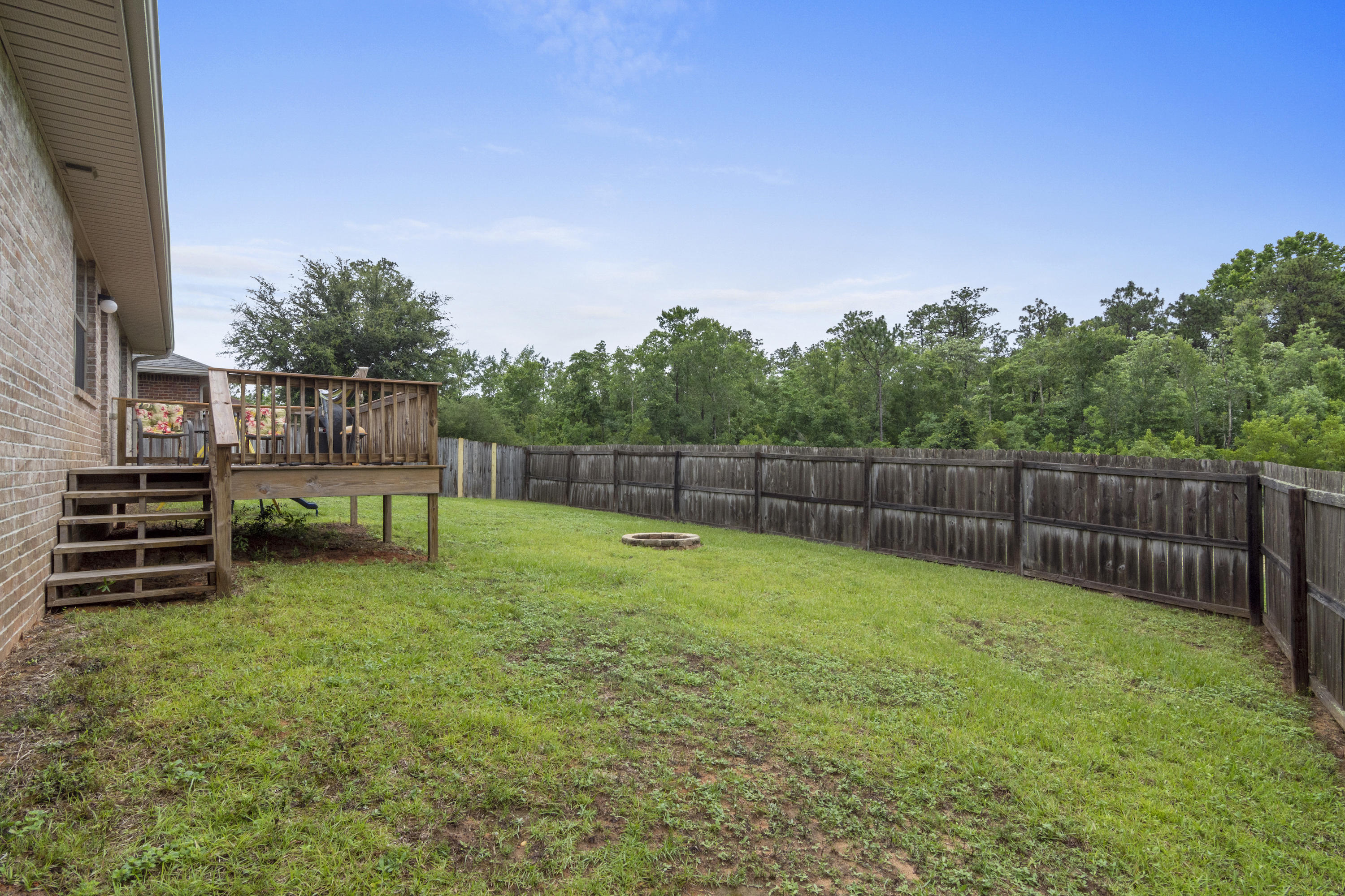 306 Gauntlet Drive Crestview, FL 32539 - Photo 29 of 32 a view of a backyard with a fence