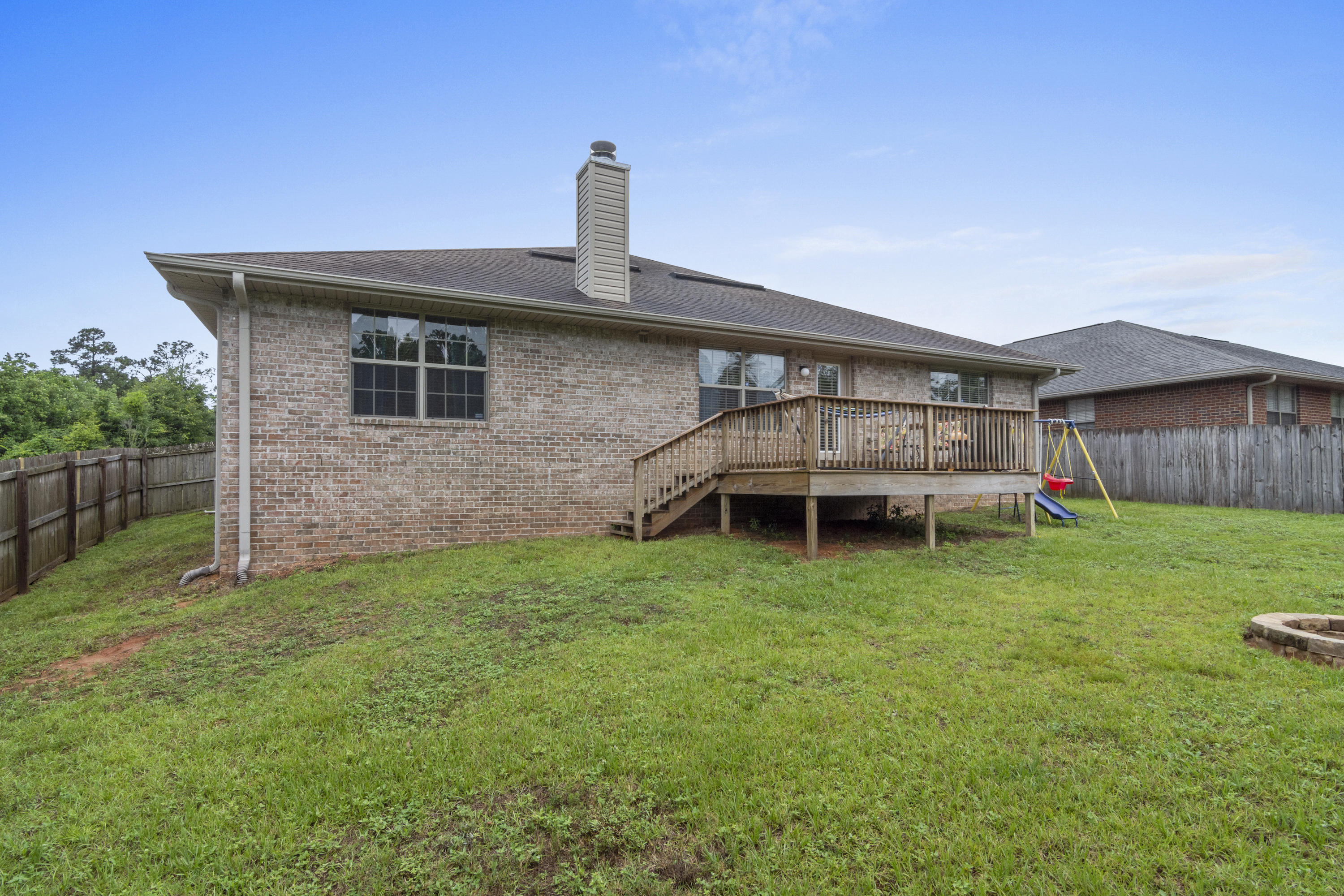 306 Gauntlet Drive Crestview, FL 32539 - Photo 30 of 32 a front view of a house with garden