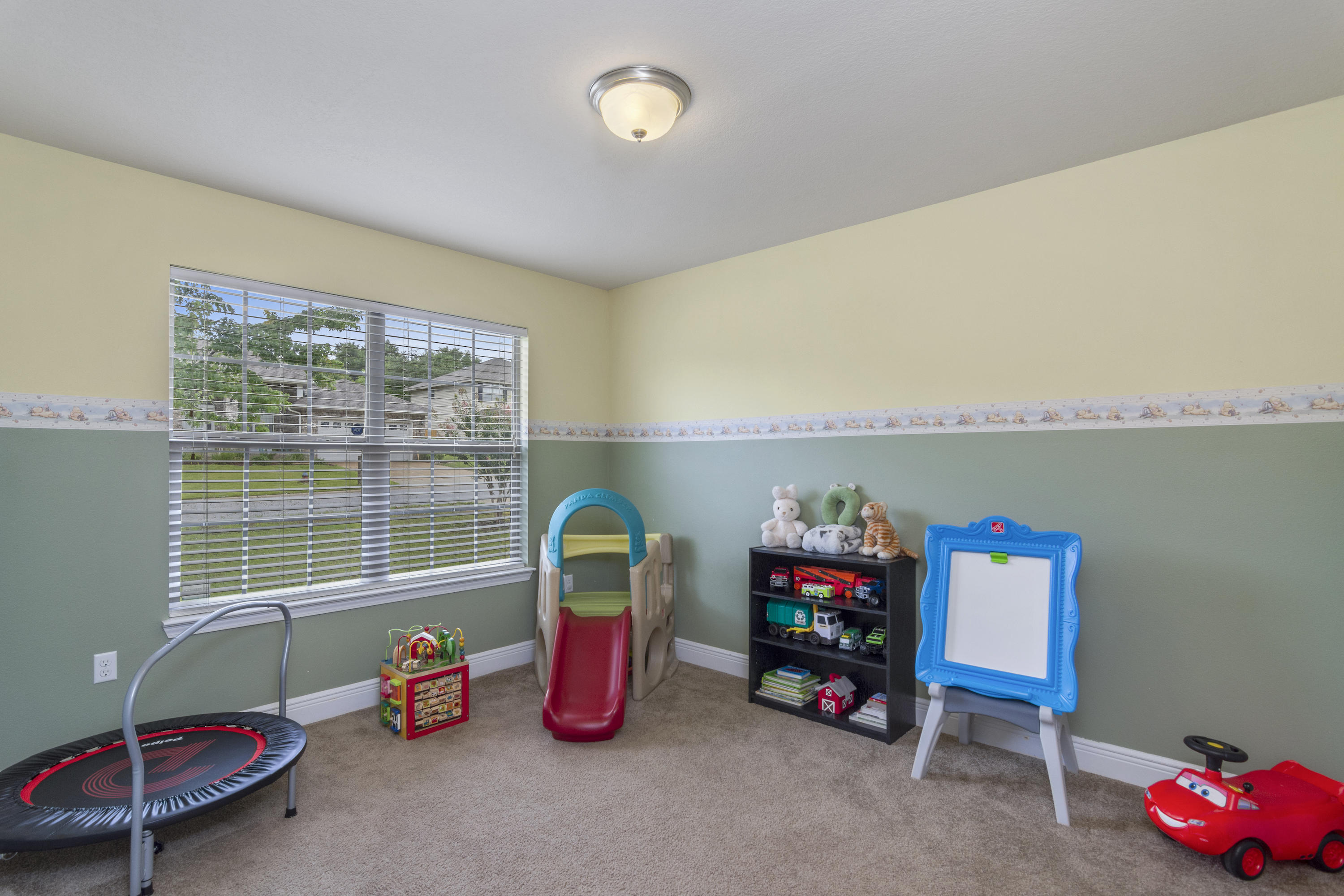 306 Gauntlet Drive Crestview, FL 32539 - Photo 5 of 32 a bedroom with furniture and a large window