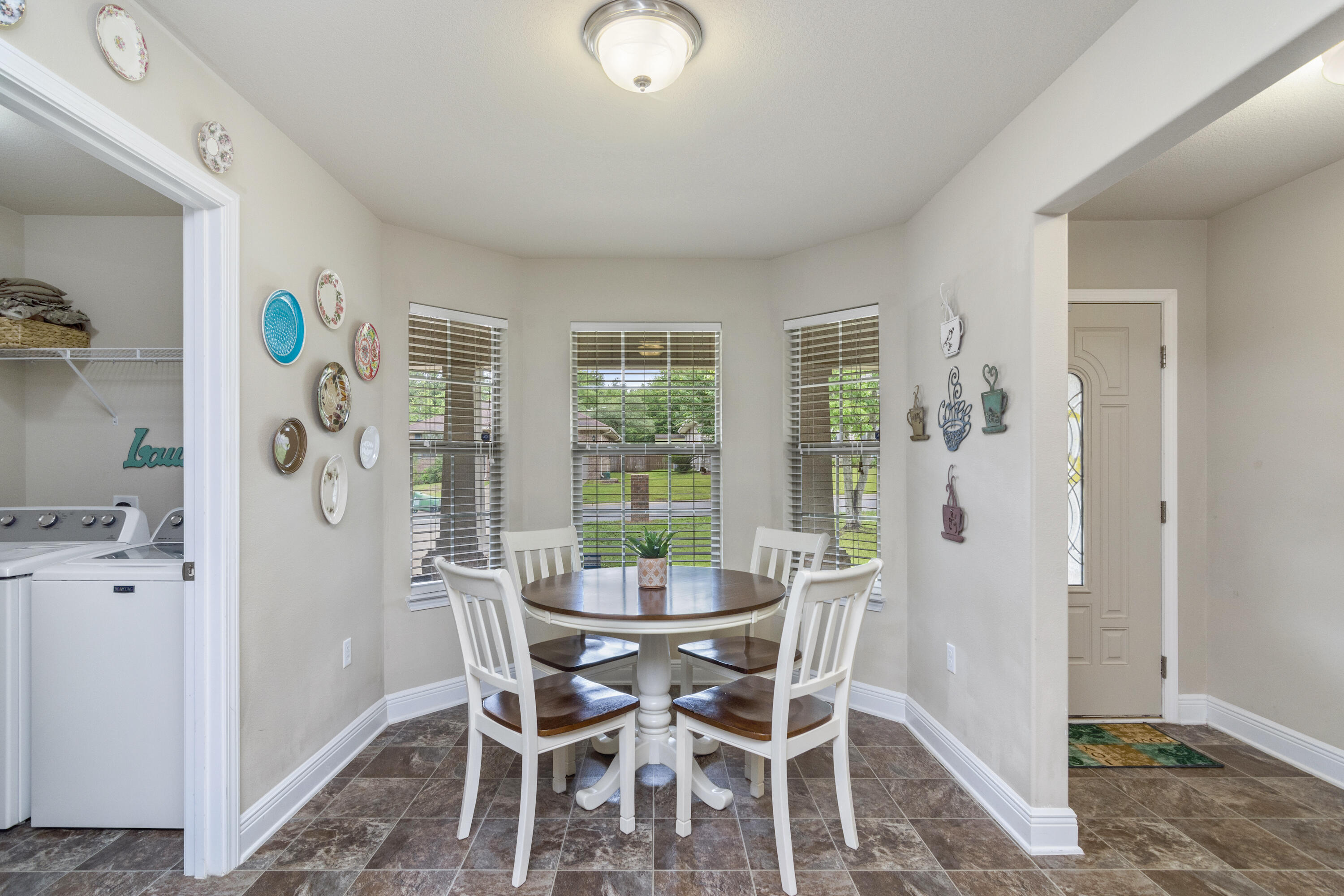 306 Gauntlet Drive Crestview, FL 32539 - Photo 10 of 32 a dining room with furniture and window