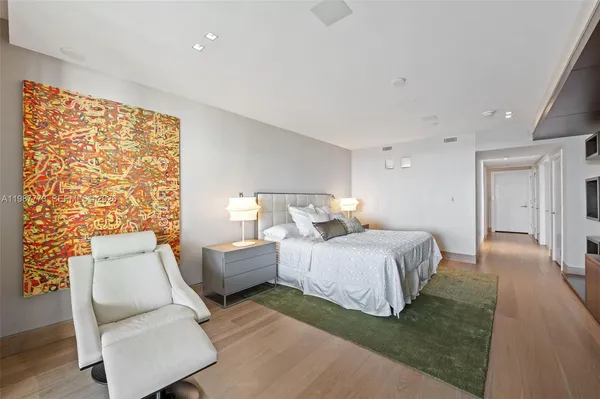 a bathroom with a sink a mirror and a bathtub