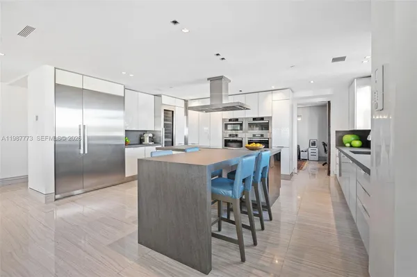 a kitchen with sink cabinets and stainless steel appliances