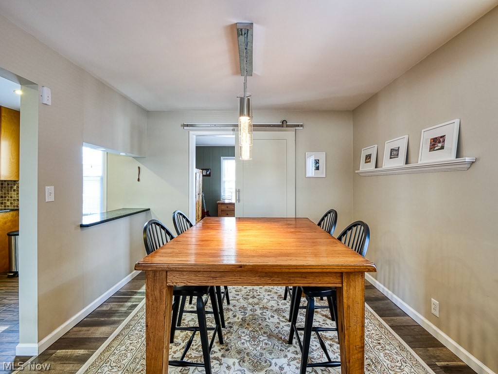 3844 Severn Road Cleveland Heights, OH 44118 - Photo 12 of 35 Dining room, exits to a bonus room, barn door for privacy, modern lighting and side window opening.