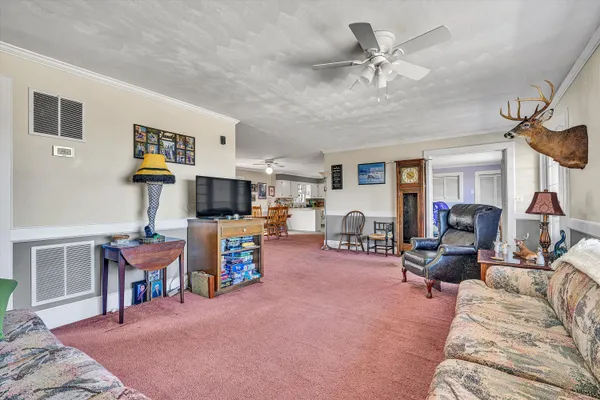 a view of a room with workspace and windows