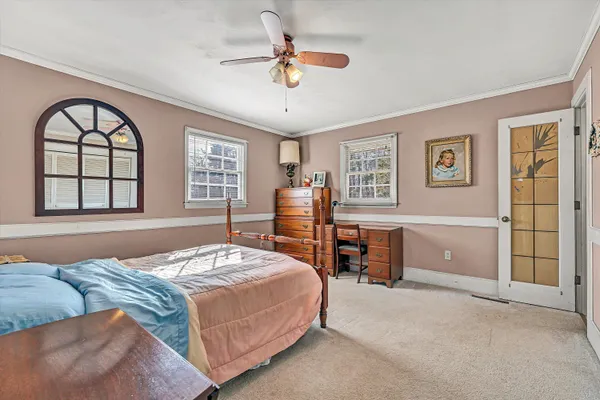 a bathroom with a sink a mirror and a shower