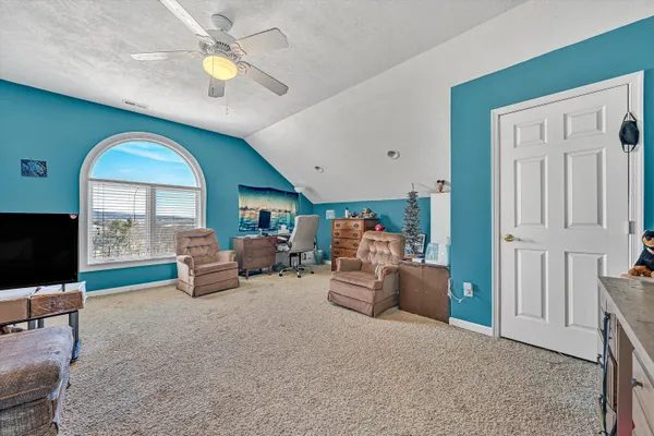 a bathroom with a toilet and a shower curtain