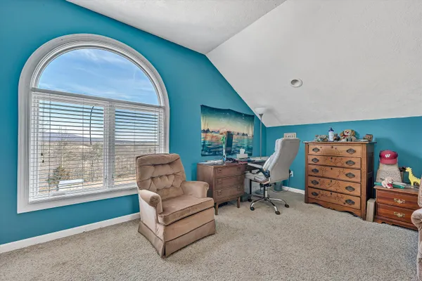 a view of an empty room with glass door