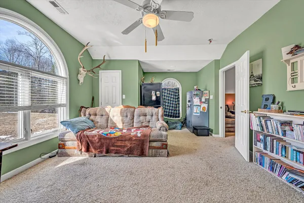 a kitchen with stainless steel appliances granite countertop a refrigerator a stove and a sink with wooden floor