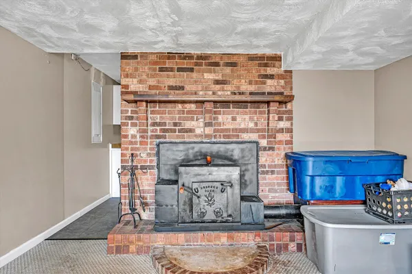 a front view of a house with a yard covered with snow in front of house