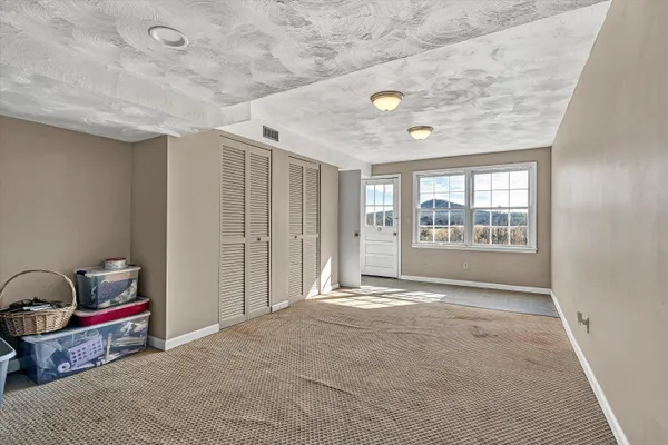 a view of an ocean and a mountain