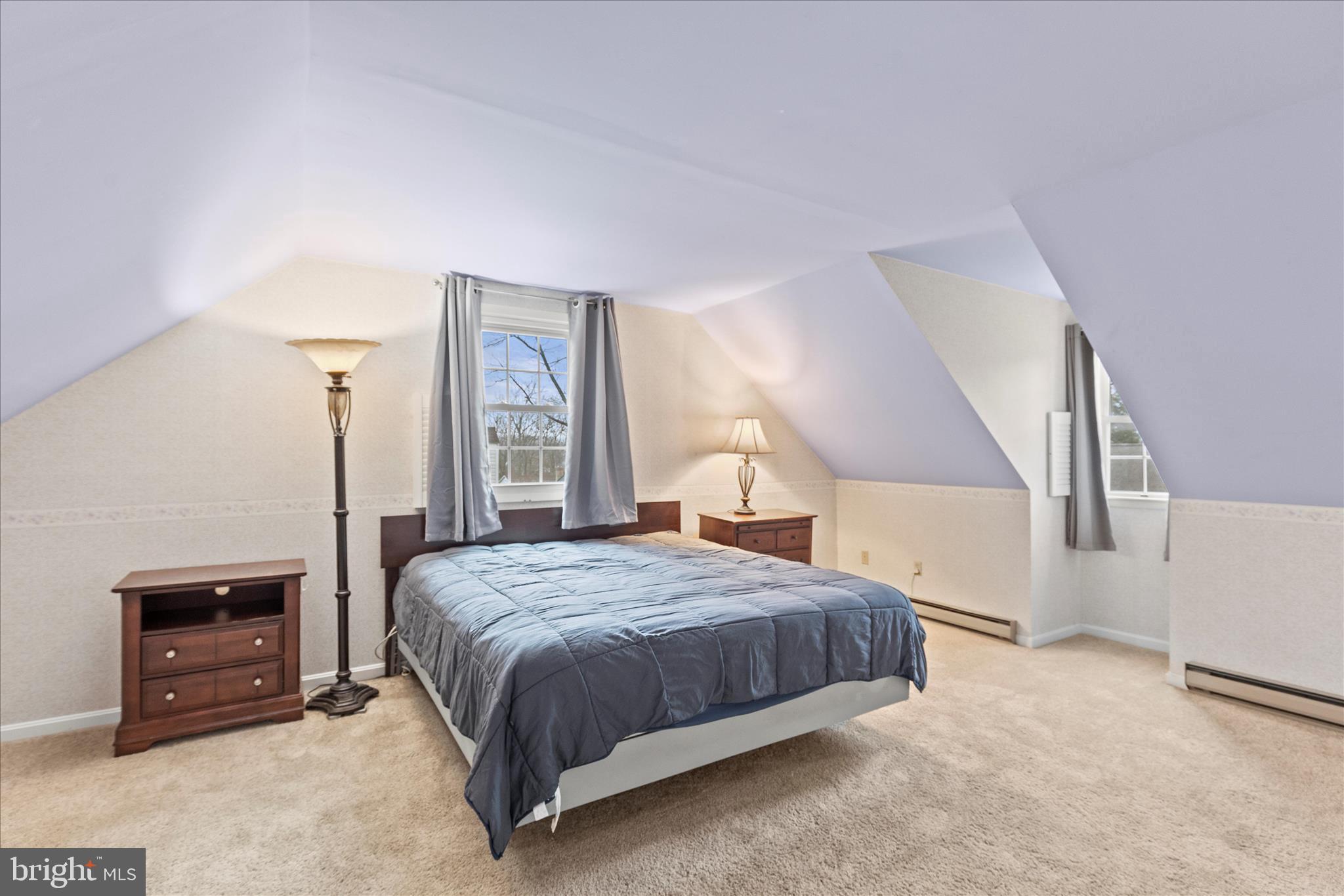 15 Sheridan Drive Hanover, PA 17331 - Photo 25 of 49 a bedroom with a bed a fireplace and a large mirror