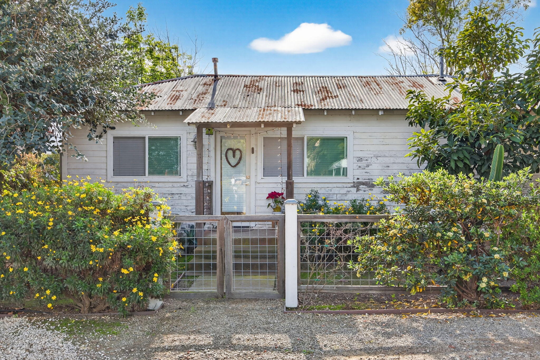 4253 Carpinteria Avenue Carpinteria, CA 93013 - Photo 5 of 11 a front view of a house with garden