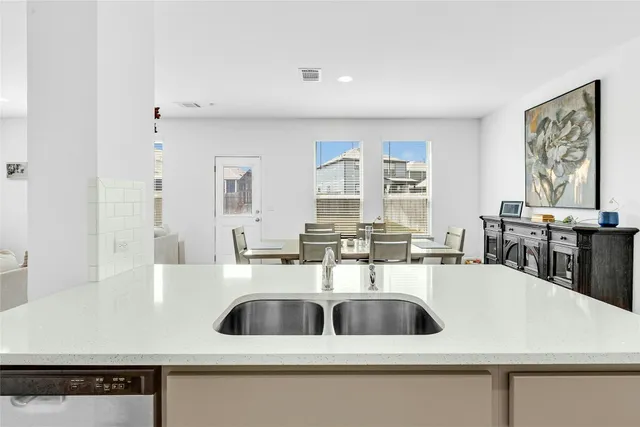 a kitchen with a sink a refrigerator and a sink