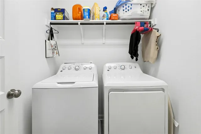 a bathroom with a sink a toilet a mirror a bathtub and shower