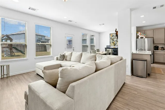 a living room with furniture and a table