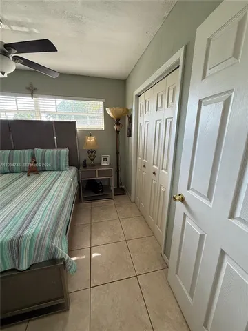 a bedroom with a bed and a walk in closet