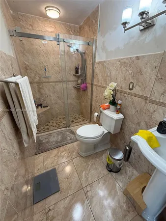 a bathroom with a sink and toilet