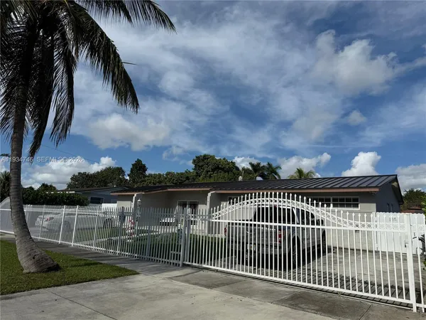 a view of a wrought iron fences in front of house