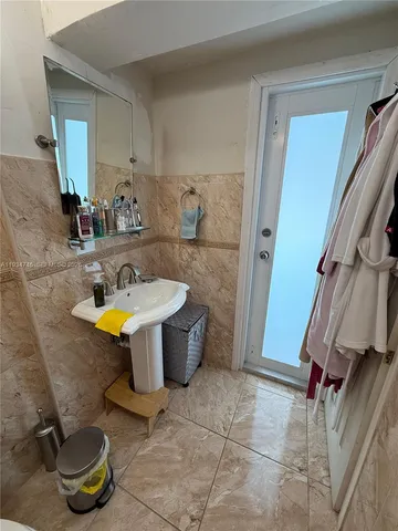 a bathroom with a sink a bathtub and shower