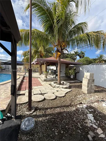 a view of a yard with a patio