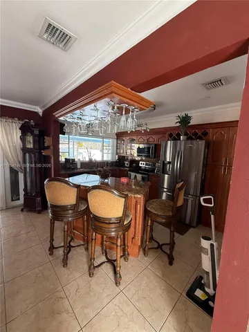 a view of a chairs and table in a room