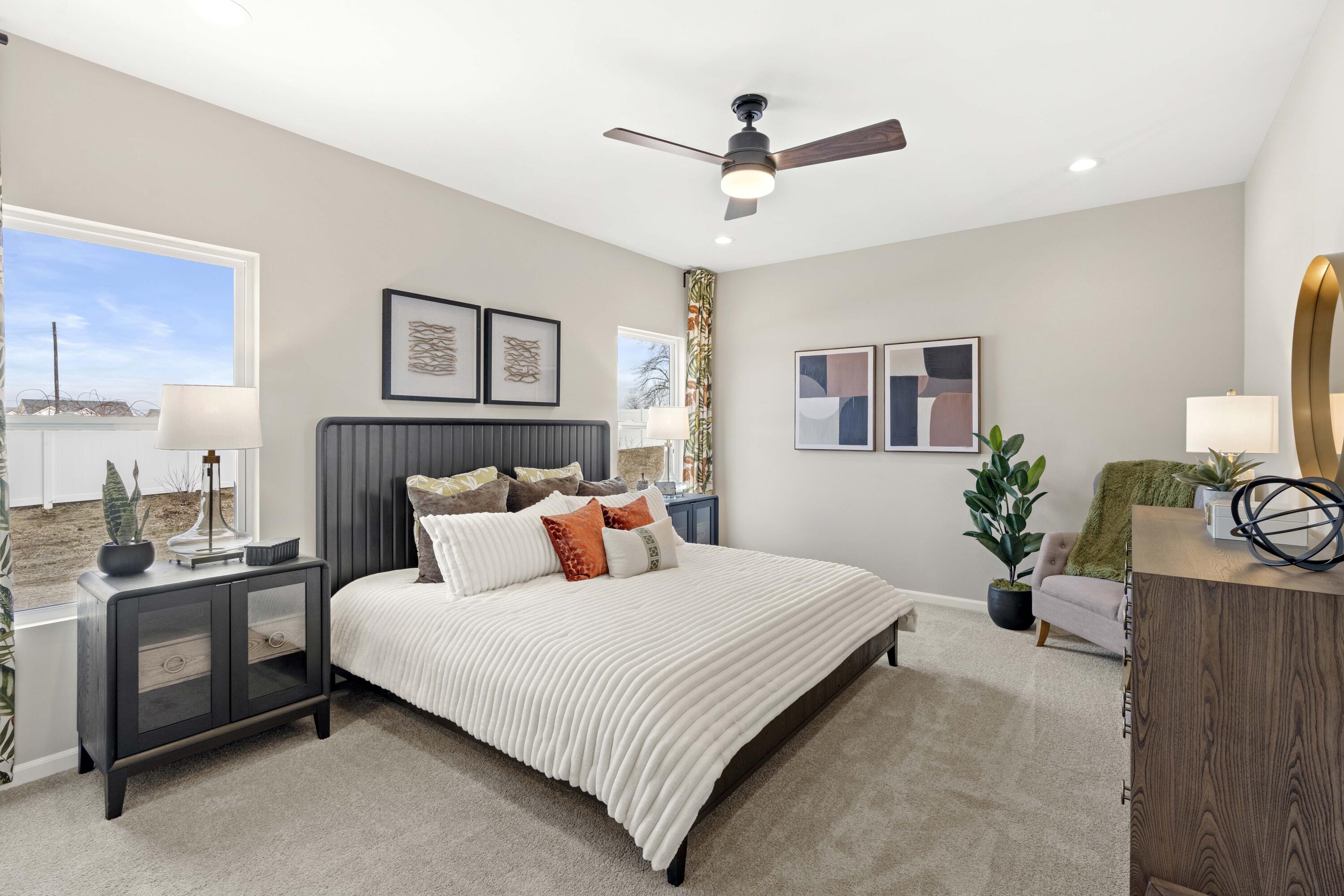 10362 Knox Street Crown Point, IN 46307 - Photo 12 of 14 a bedroom with a large bed and a chandelier