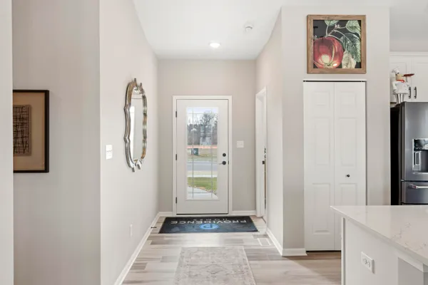 a view of a hallway with paintings on the wall
