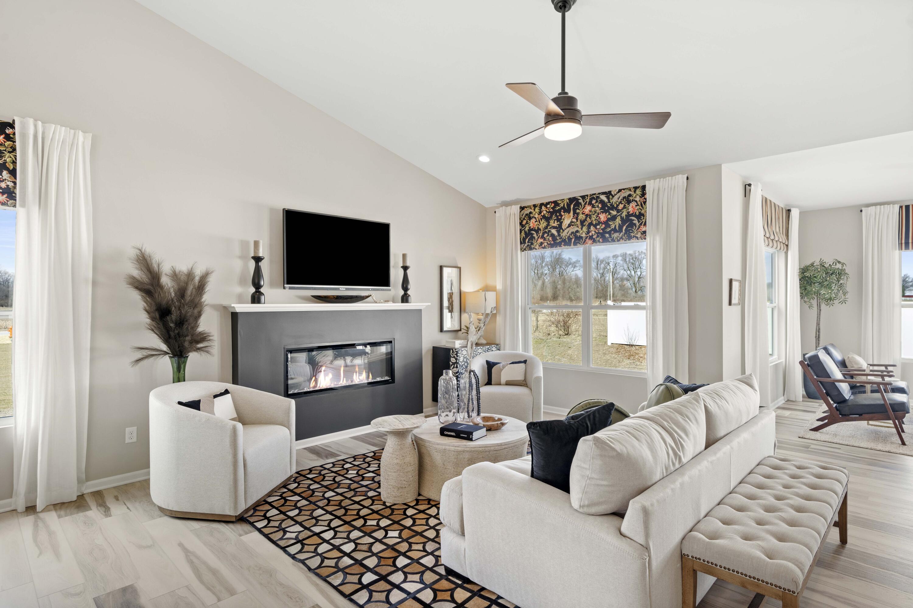 10362 Knox Street Crown Point, IN 46307 - Photo 6 of 14 a living room with furniture a fireplace and a flat screen tv