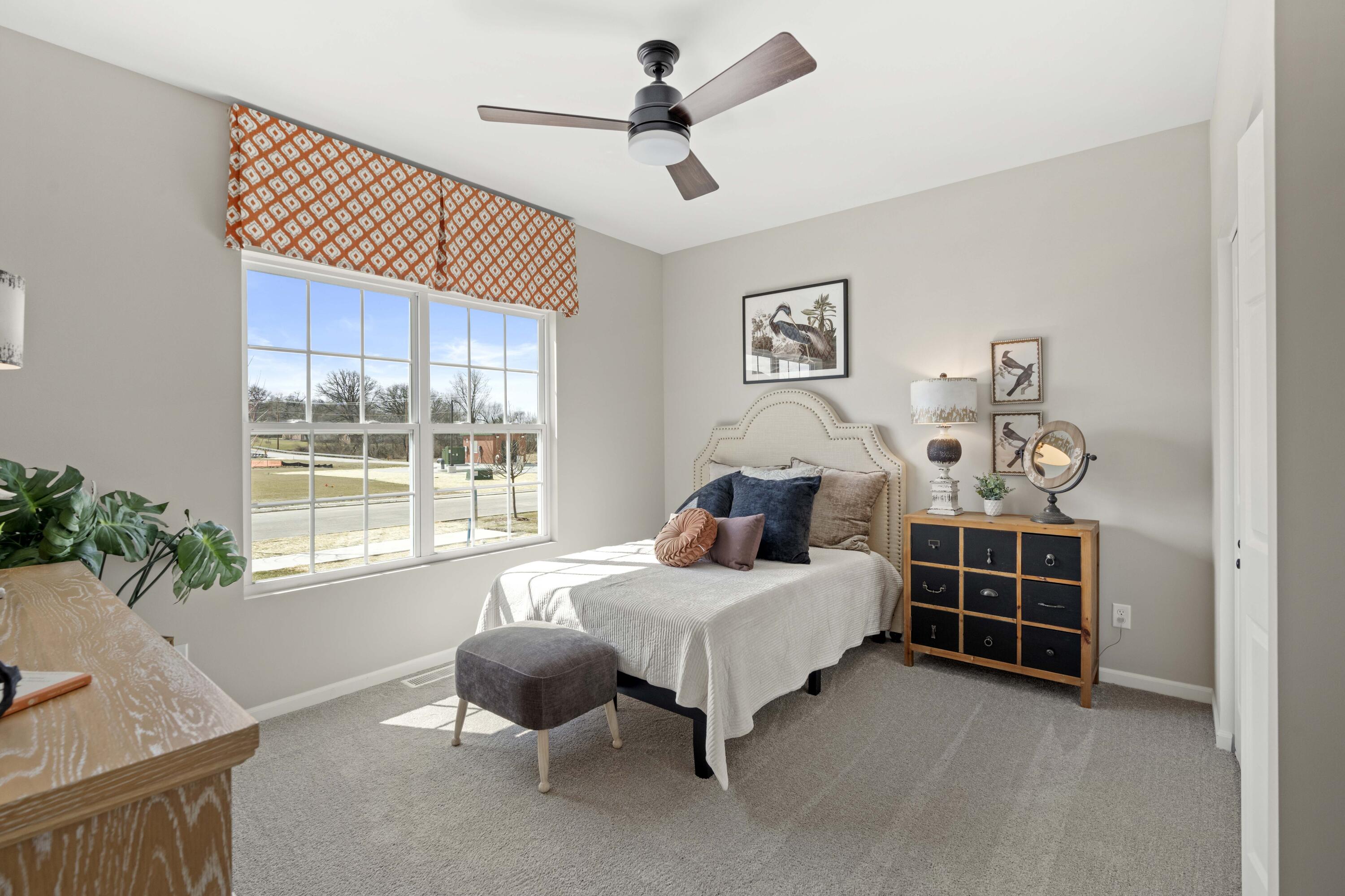 10362 Knox Street Crown Point, IN 46307 - Photo 8 of 14 a bedroom with a bed and a chandelier