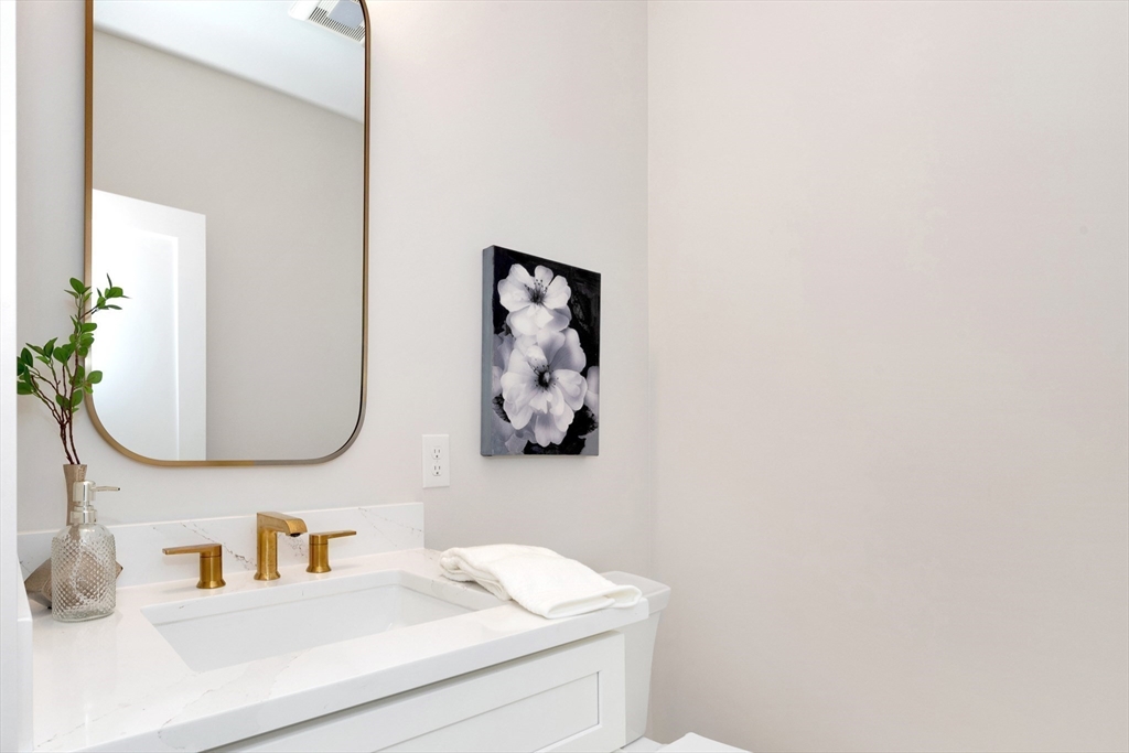 354 Ridge Street Arlington, MA 02474 - Photo 11 of 42 a bathroom with a sink and a mirror
