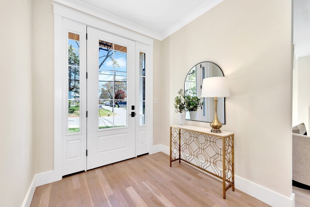 354 Ridge Street Arlington, MA 02474 - Photo 13 of 42 a view of a livingroom with wooden floor table and hallway